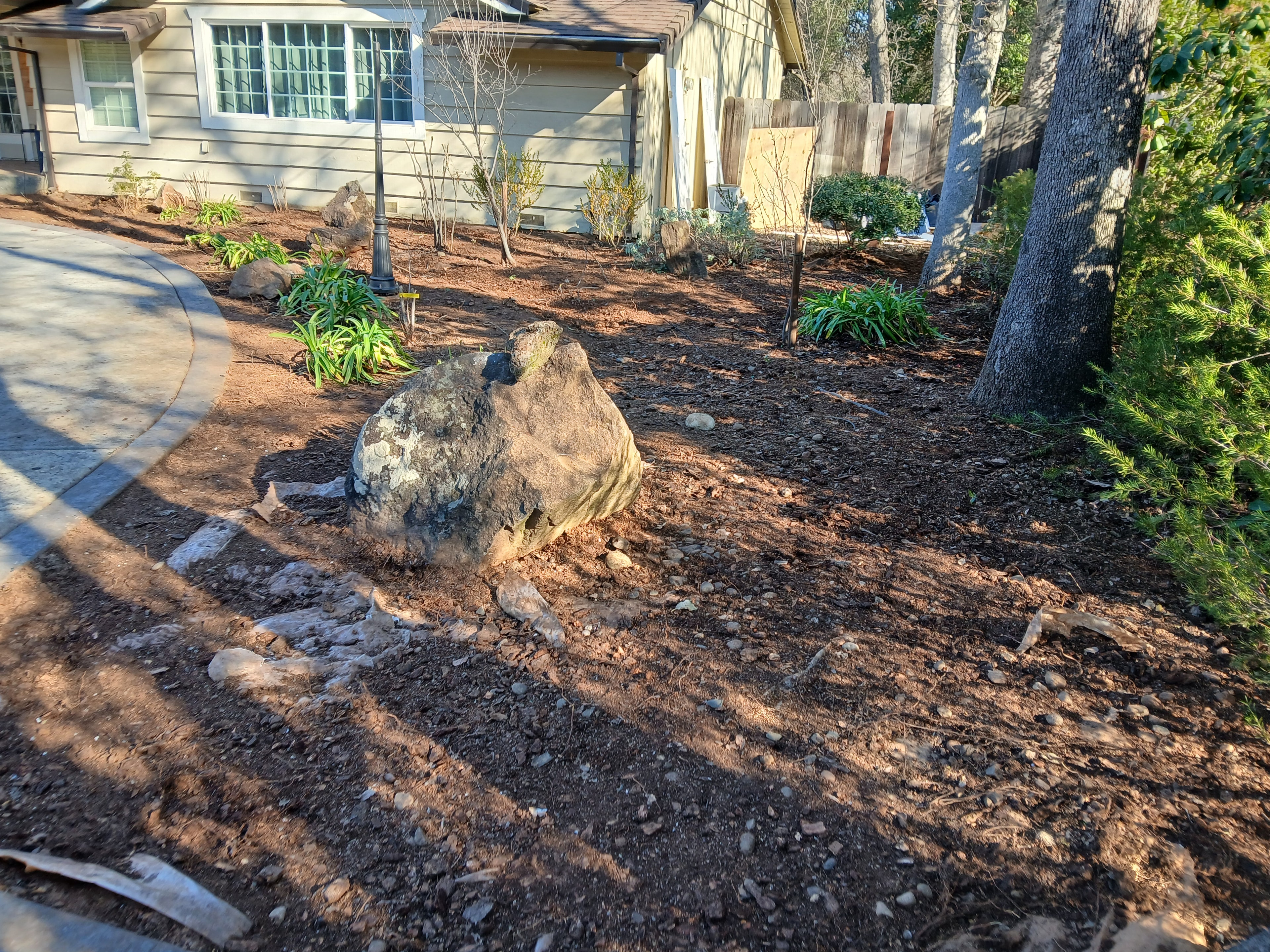 Rock and mulch installation at residential property